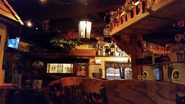 Tavern interior with tables, chairs and wall decor