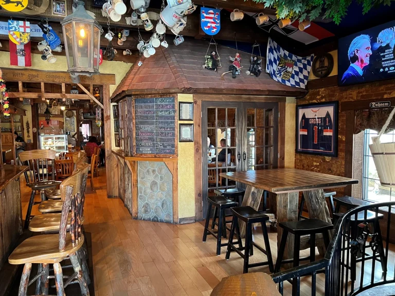 Tavern interior with tables, chairs and wall decor